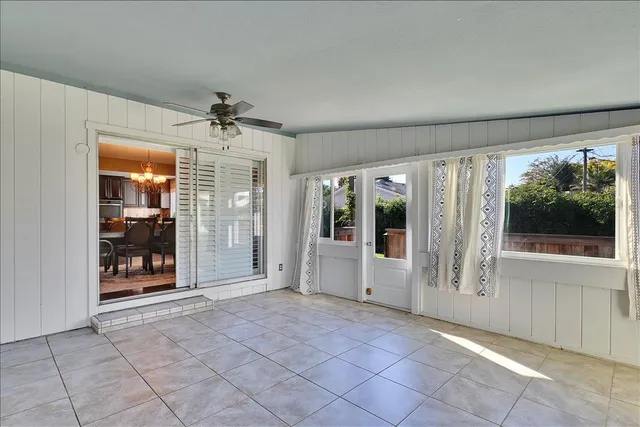 a house view with a sitting space and garden