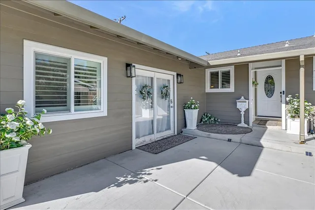 a kitchen with stainless steel appliances kitchen island granite countertop a stove refrigerator and cabinets