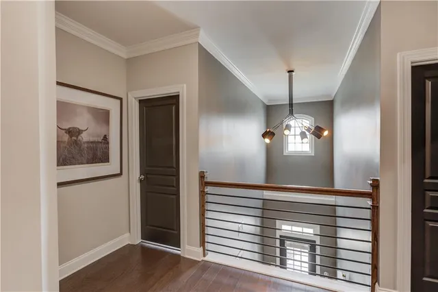 a bedroom with bed and a large window