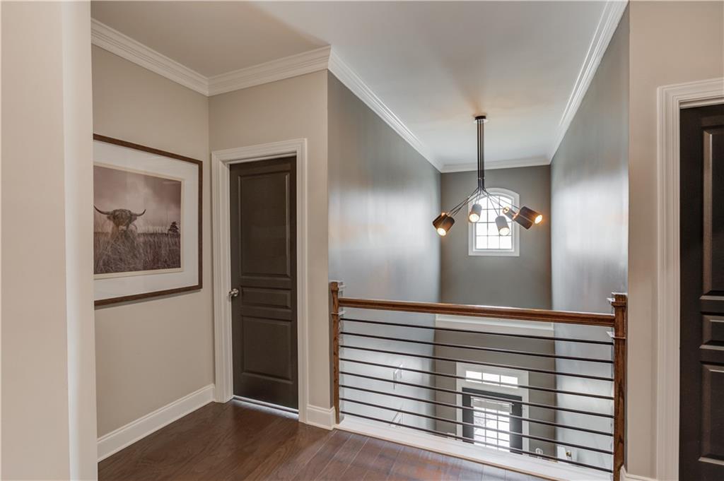 542 Flyingbolt Run Canton, GA 30115 - Photo 22 of 55 a view of a hallway with entryway and chandelier