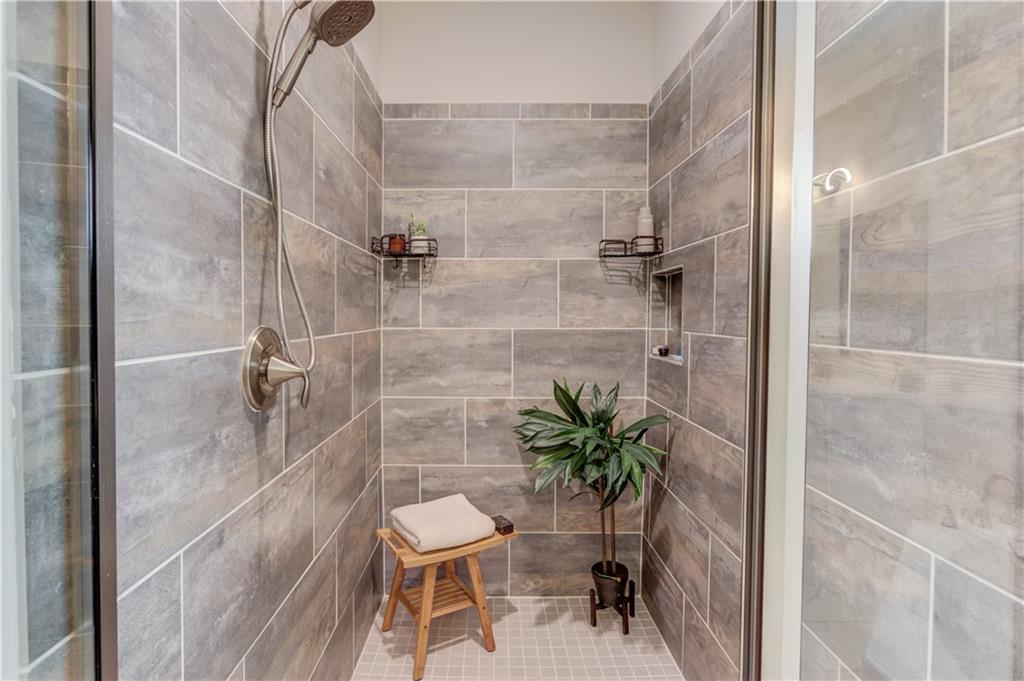 542 Flyingbolt Run Canton, GA 30115 - Photo 28 of 55 a bathroom with a shower and a sink