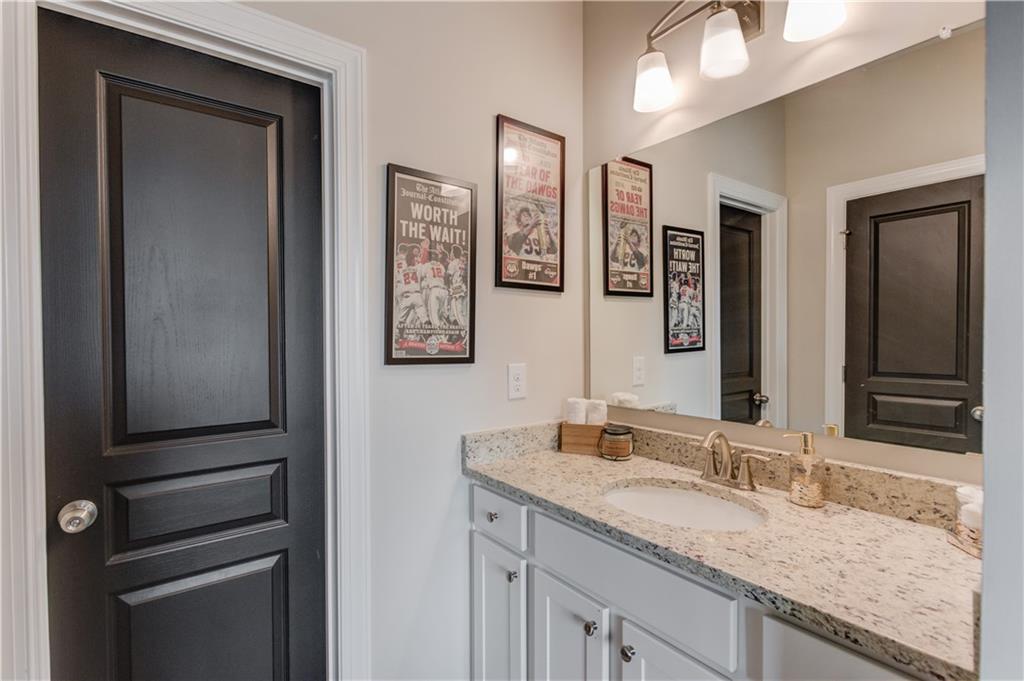 542 Flyingbolt Run Canton, GA 30115 - Photo 36 of 55 a bathroom with a granite countertop double vanity sink and a mirror