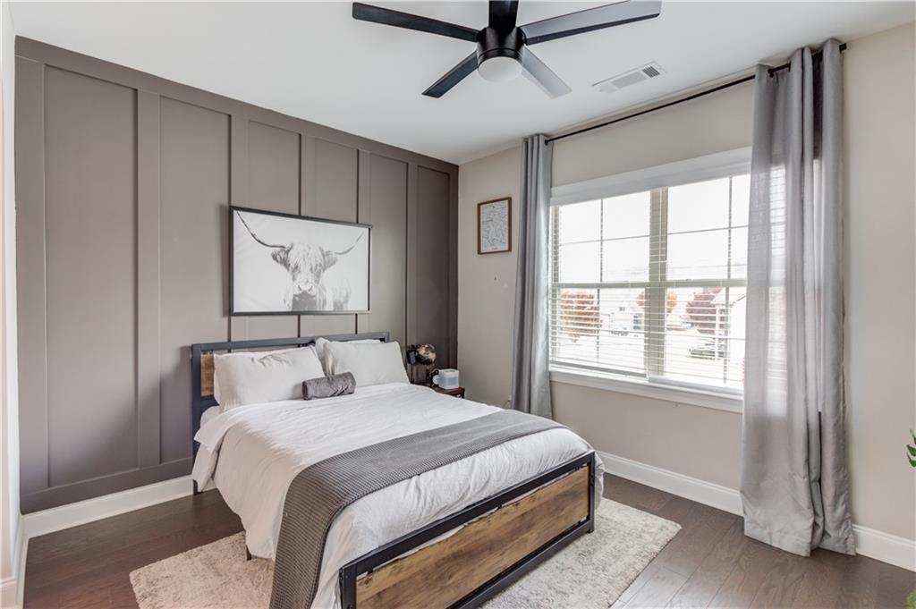 542 Flyingbolt Run Canton, GA 30115 - Photo 37 of 55 a bedroom with a large bed and a window