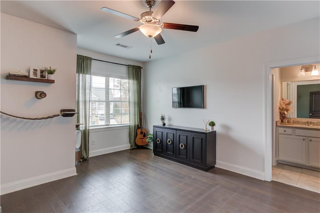 542 Flyingbolt Run Canton, GA 30115 - Photo 39 of 55 a living room with furniture and a flat screen tv