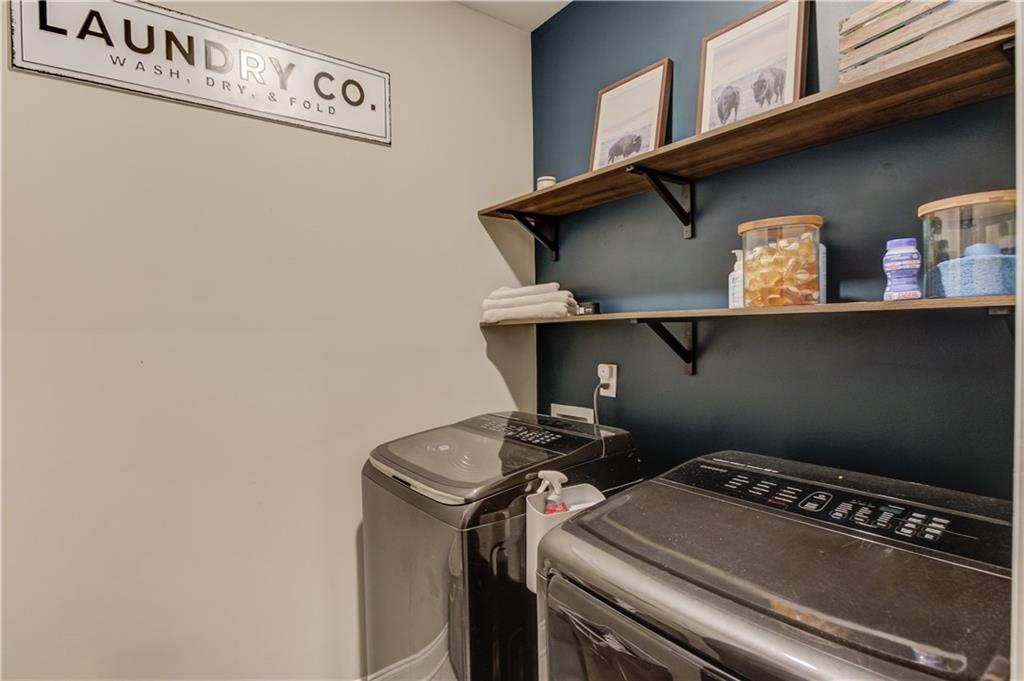 542 Flyingbolt Run Canton, GA 30115 - Photo 42 of 55 a utility room with dryer and washer