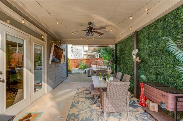 a backyard of a house with outdoor seating