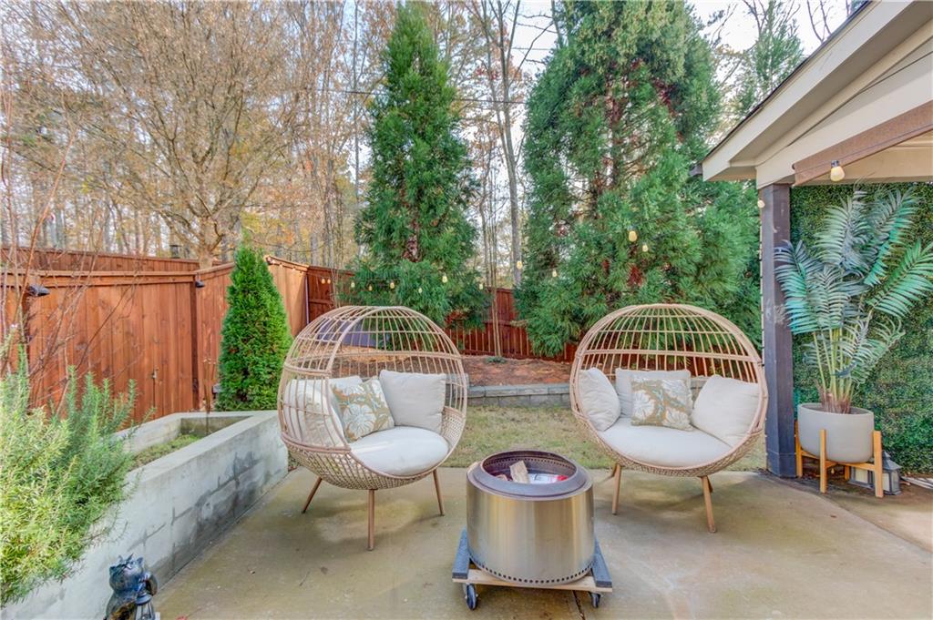 542 Flyingbolt Run Canton, GA 30115 - Photo 45 of 55 a view of a chair and table in backyard of the house