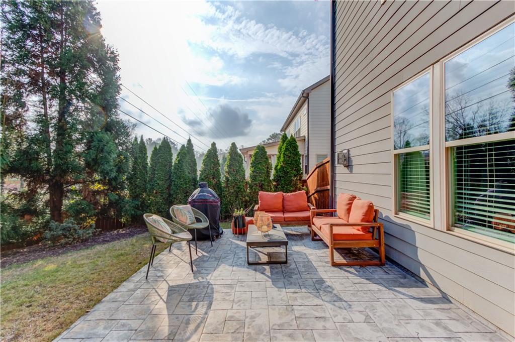 542 Flyingbolt Run Canton, GA 30115 - Photo 46 of 55 a backyard of a house with outdoor seating