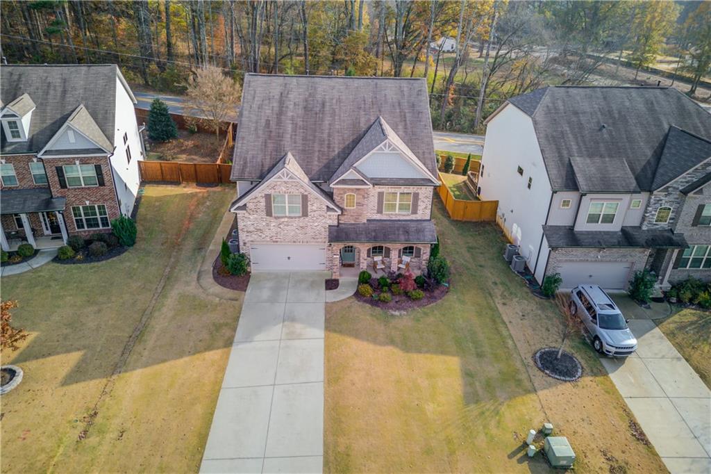 542 Flyingbolt Run Canton, GA 30115 - Photo 48 of 55 an aerial view of a house with swimming pool and wooden fence