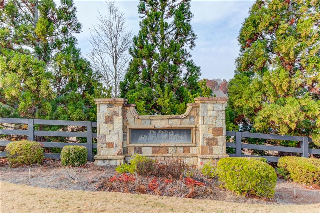 542 Flyingbolt Run Canton, GA 30115 - Photo 50 of 55 a view of a patio with table and chairs and potted plants