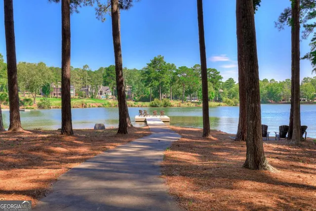 a view of a chairs and table in patio