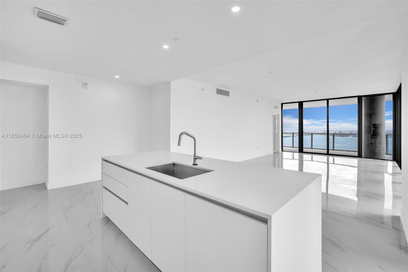 700 Northeast 24th Street, Unit 4507 Miami, FL 33137 - Photo 15 of 70 a kitchen with a sink and large window
