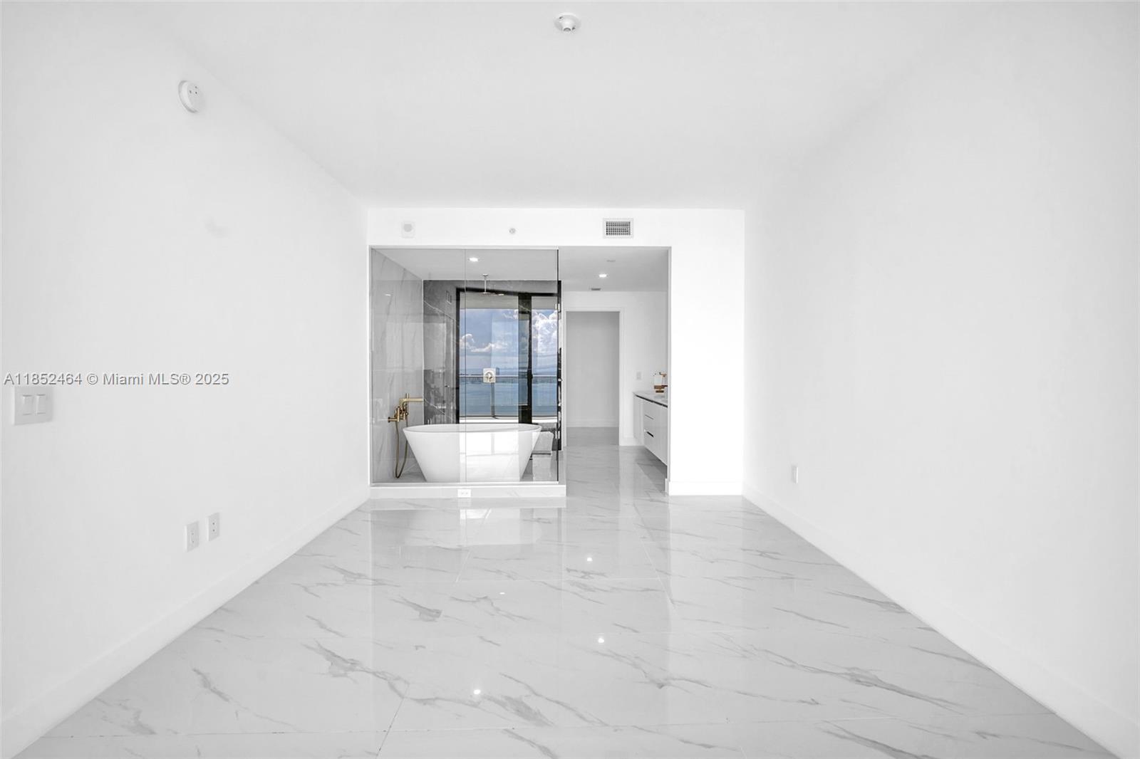 700 Northeast 24th Street, Unit 4507 Miami, FL 33137 - Photo 22 of 70 a view of a white room with a white bed