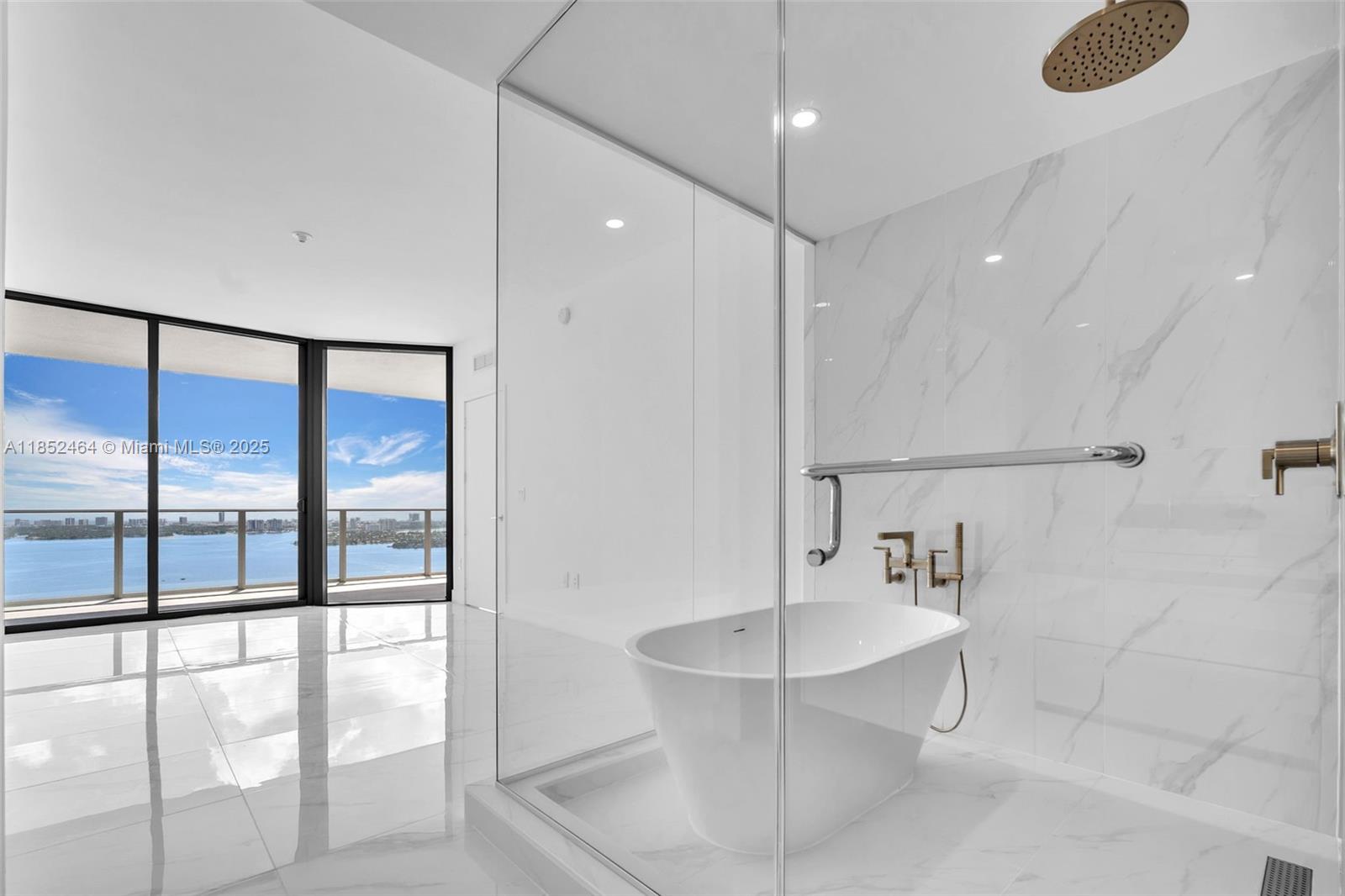 700 Northeast 24th Street, Unit 4507 Miami, FL 33137 - Photo 25 of 70 a spacious bathroom with a glass shower door and a sink