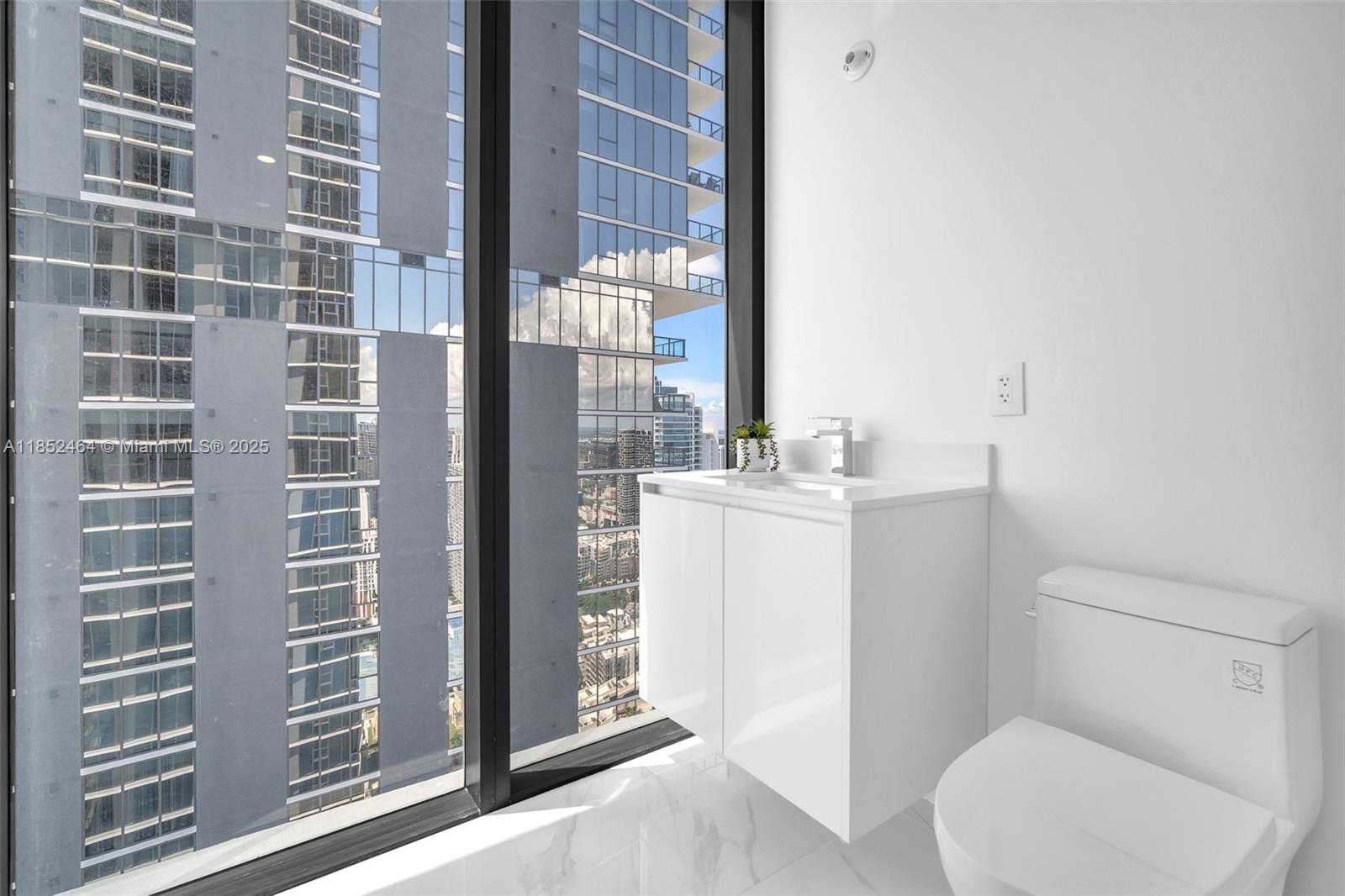 700 Northeast 24th Street, Unit 4507 Miami, FL 33137 - Photo 33 of 70 a bathroom with a sink toilet and shower