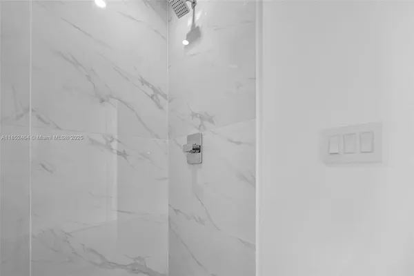 a view of an empty room with glass door