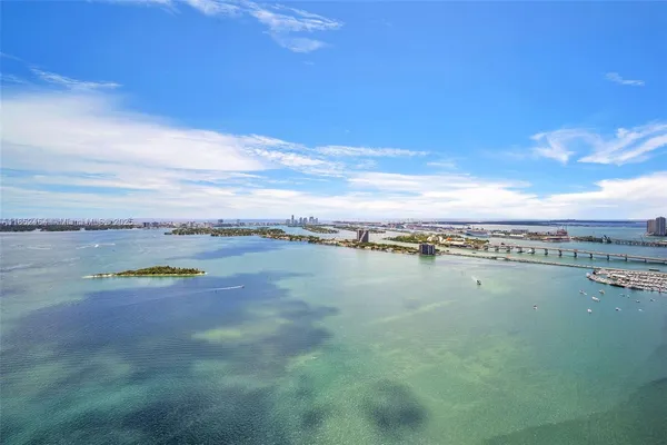 a view of a patio with couches and potted plants