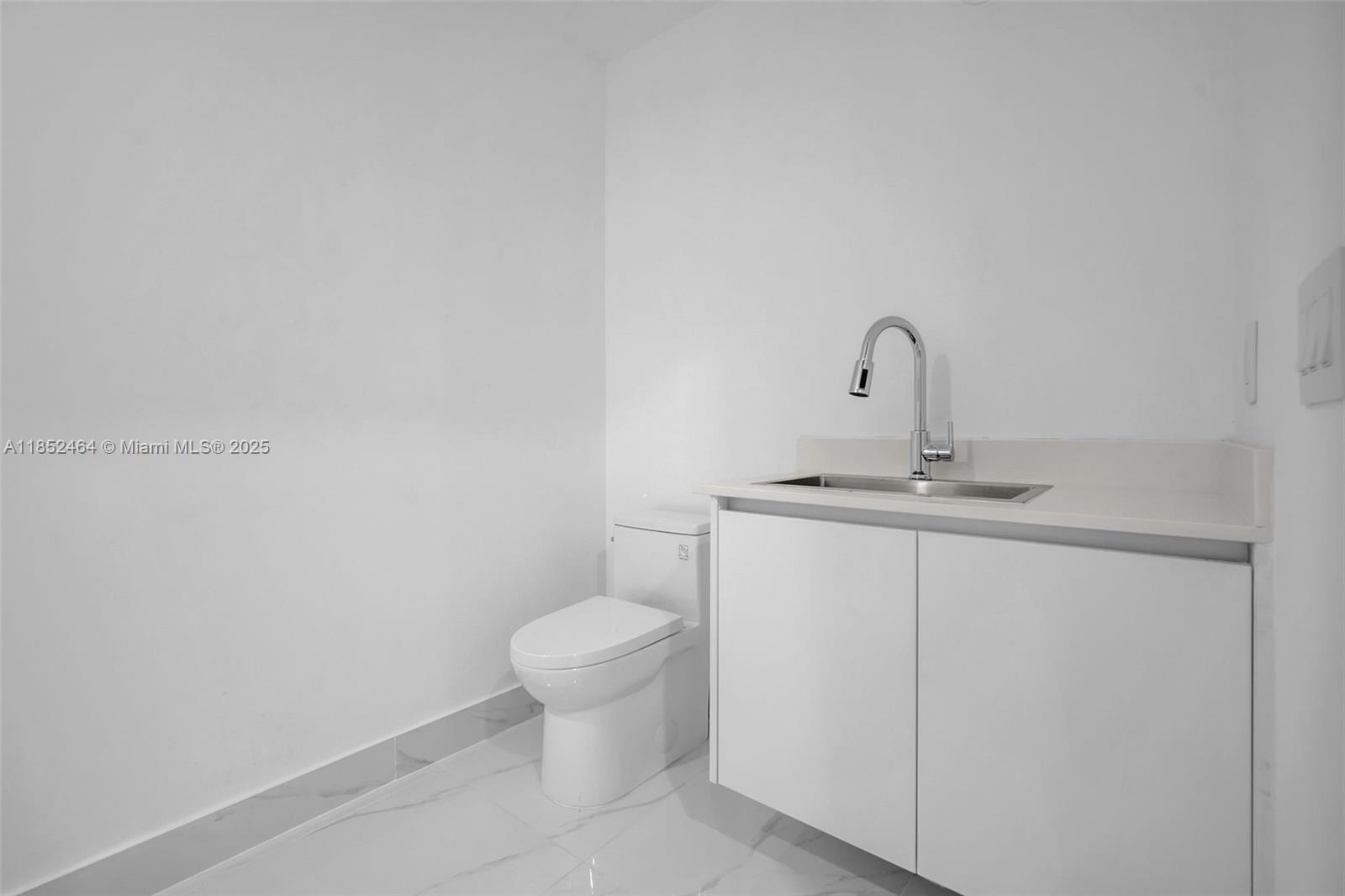 700 Northeast 24th Street, Unit 4507 Miami, FL 33137 - Photo 45 of 70 a bathroom with a sink and a toilet