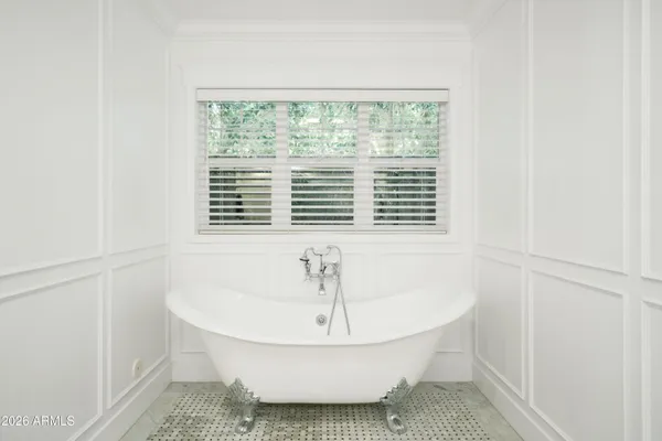 a bathroom with a sink and a window