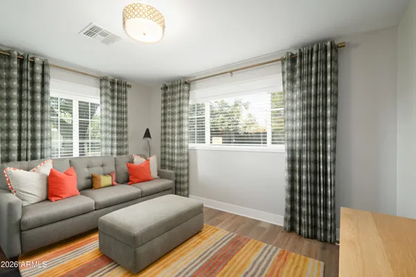 a living room with furniture and a window