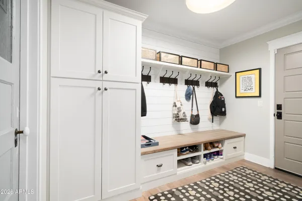 a view of walk in closet with window and shower