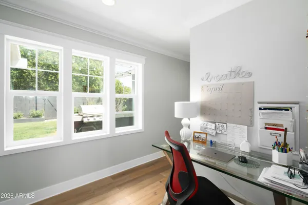 a workspace with furniture and a window