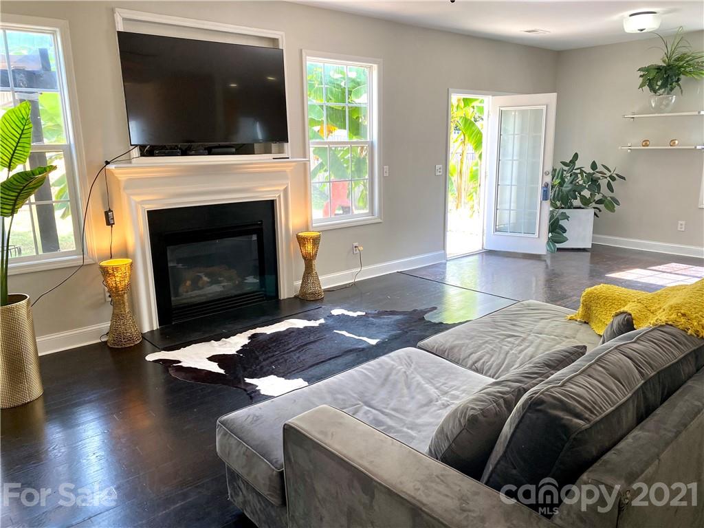 11414 Erwin Ridge Avenue Charlotte, NC 28213 - Photo 4 of 11 a bedroom with a bed and a fireplace