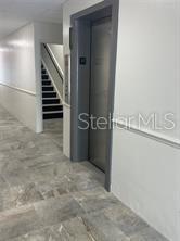 227 North Magnolia Avenue, Unit 202 Orlando, FL 32801 - Photo 5 of 6 a view of a hallway