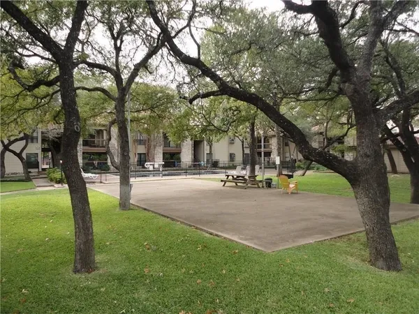 a view of a tree in front of a house