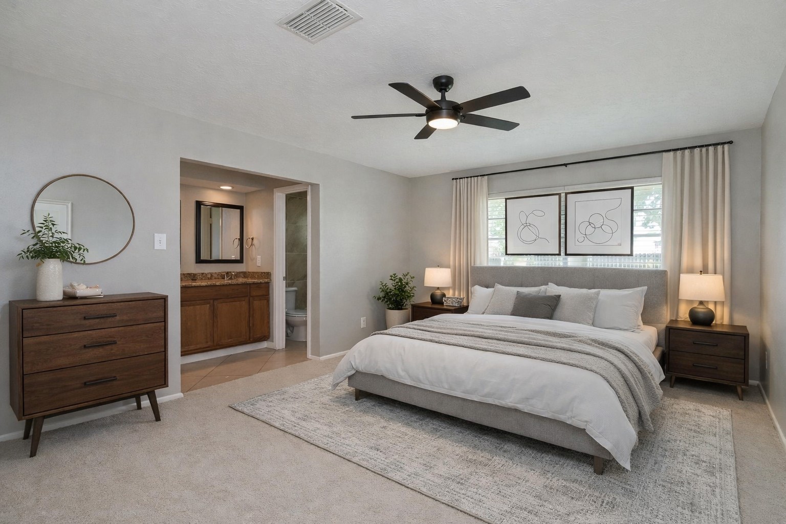 10019 Overview Drive Sugar Land, TX 77498 - Photo 17 of 30 a bedroom with a bed and a chandelier