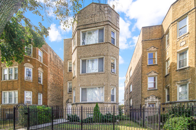 7828 South Winchester Avenue, Unit 2 Chicago, IL 60620 - Photo 1 of 1 a front view of a multi story residential apartment building