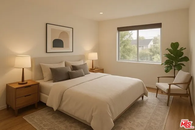 a bedroom with bed and a window