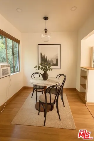a view of a dining room with furniture window and outside view