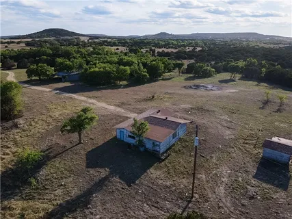 an aerial view of residential house and trees