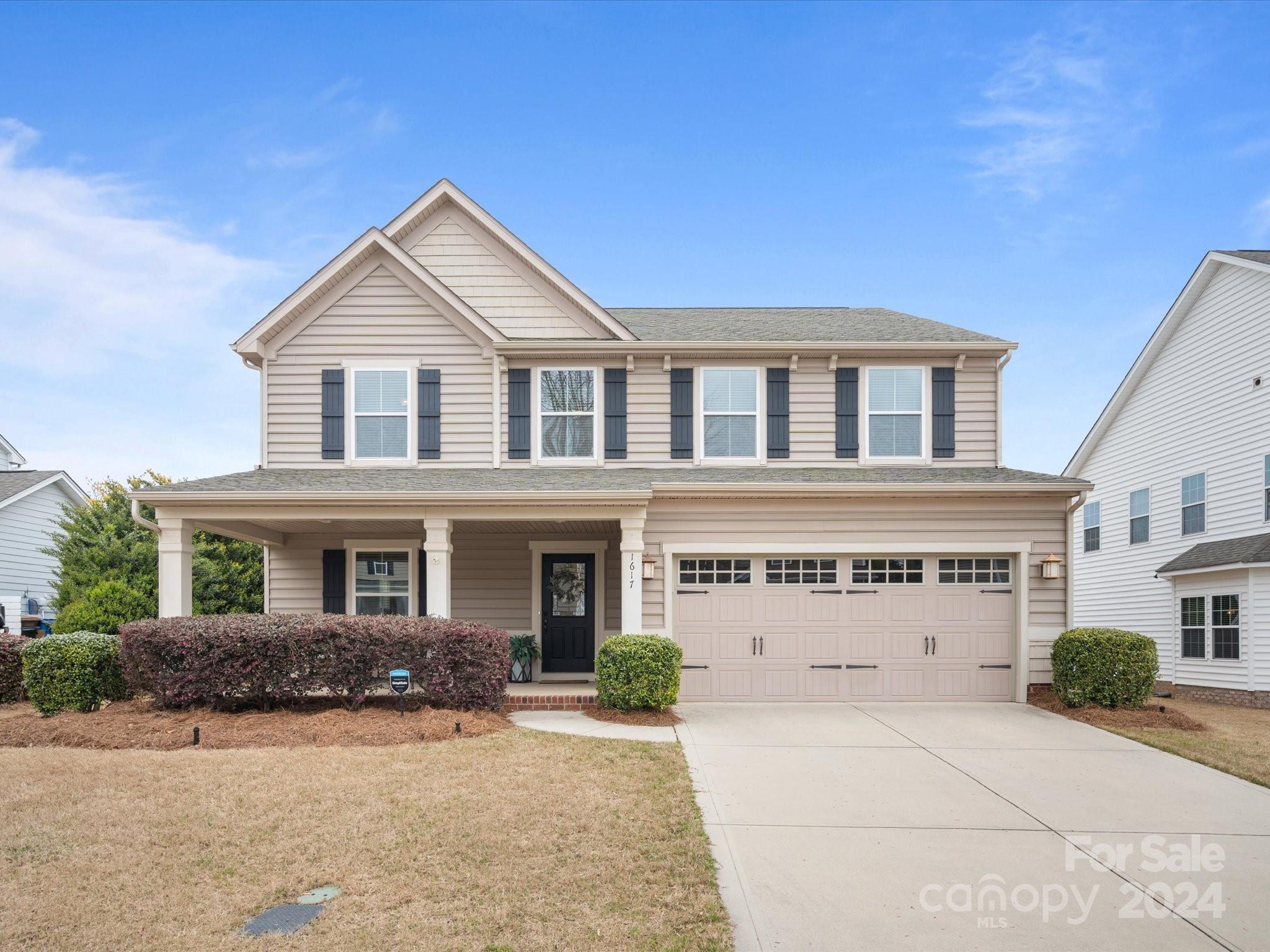 front view of a house with a yard