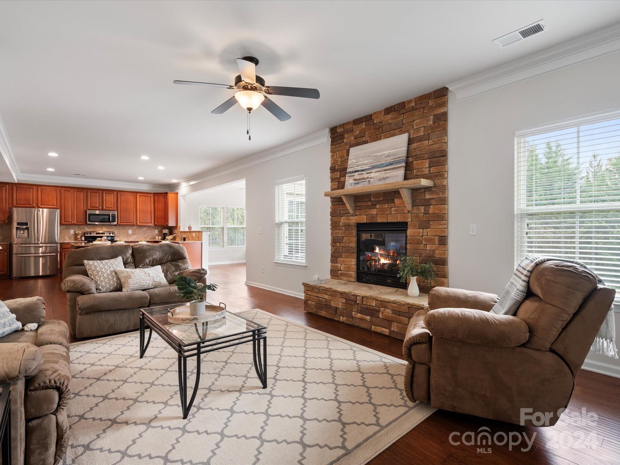 1617 Ridgehaven Road Waxhaw, NC 28173 - Photo 19 of 47 a living room with furniture and a fireplace