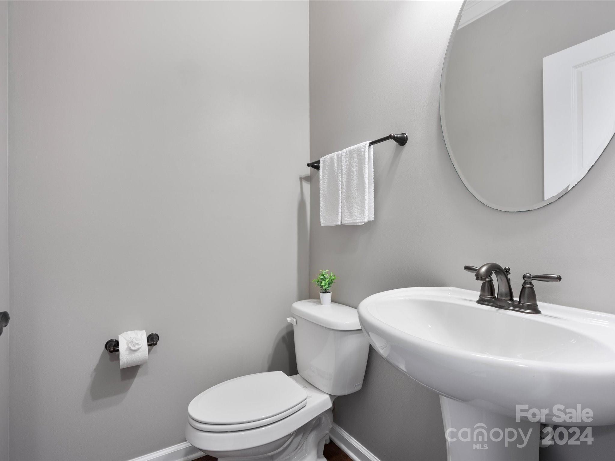 1617 Ridgehaven Road Waxhaw, NC 28173 - Photo 21 of 47 a bathroom with a sink mirror and toilet