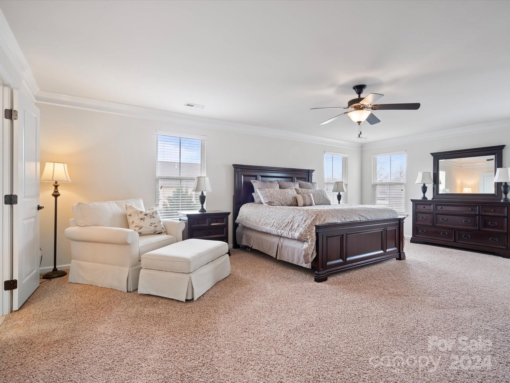 1617 Ridgehaven Road Waxhaw, NC 28173 - Photo 23 of 47 a bedroom with a bed couches and white walls