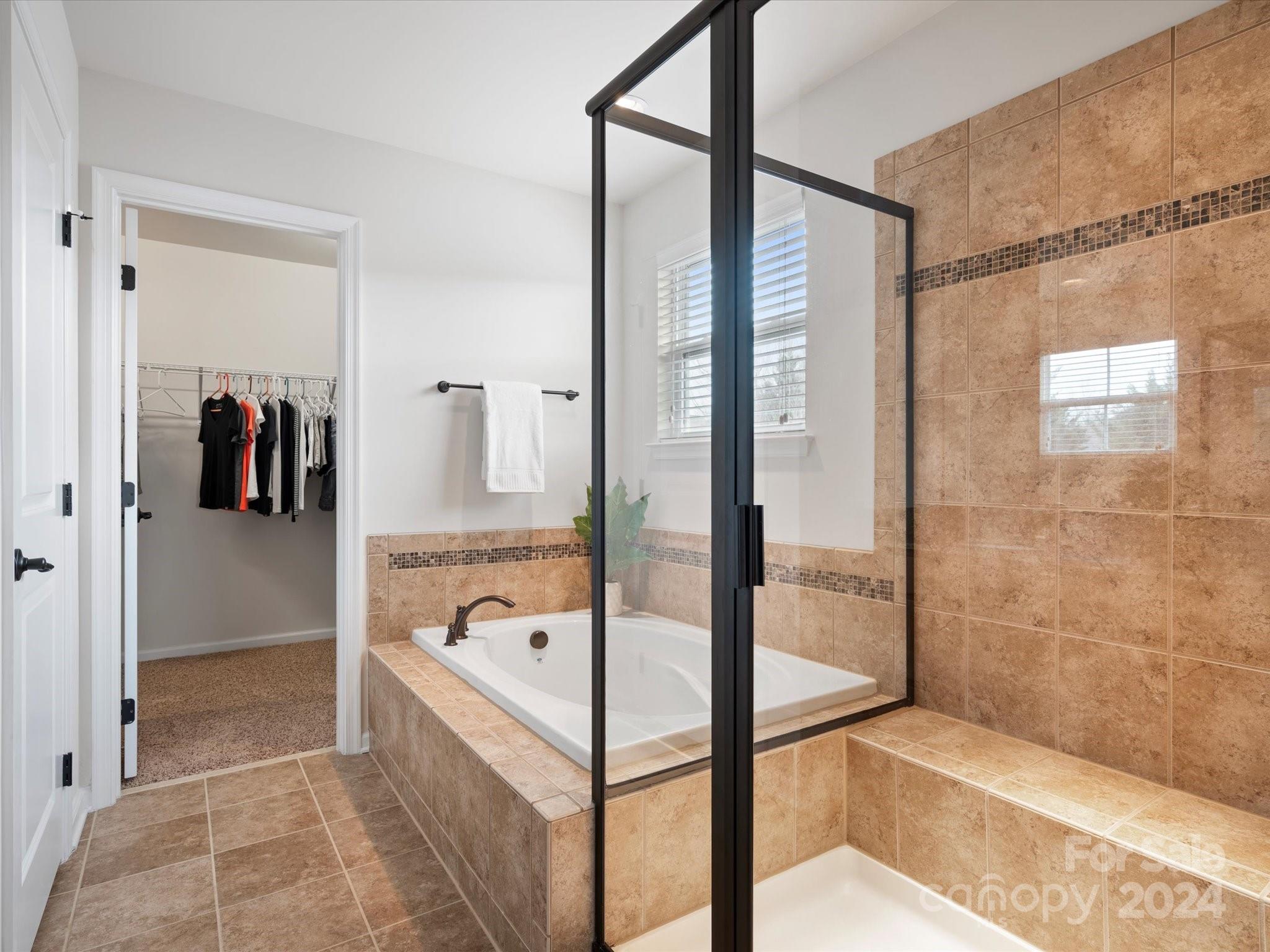 1617 Ridgehaven Road Waxhaw, NC 28173 - Photo 27 of 47 a bathroom with a tub and shower