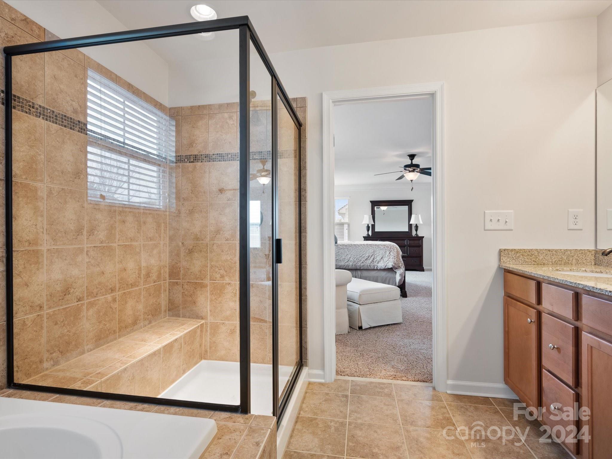 1617 Ridgehaven Road Waxhaw, NC 28173 - Photo 28 of 47 a en suite bathroom with a shower and a sink