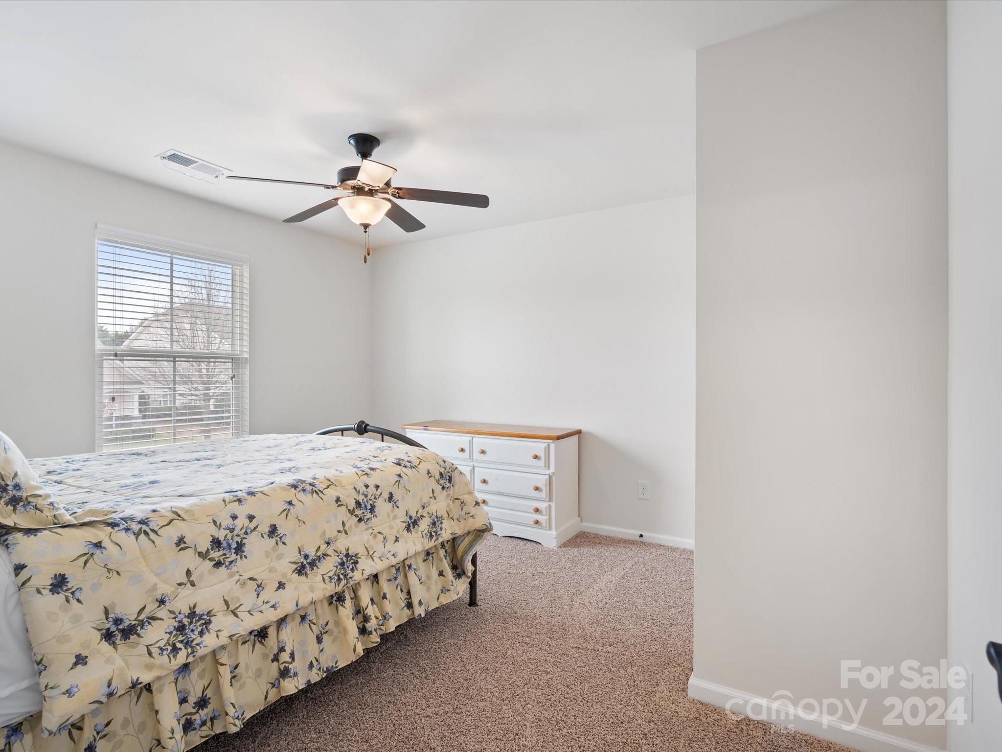 1617 Ridgehaven Road Waxhaw, NC 28173 - Photo 33 of 47 a bedroom with a bed and a window