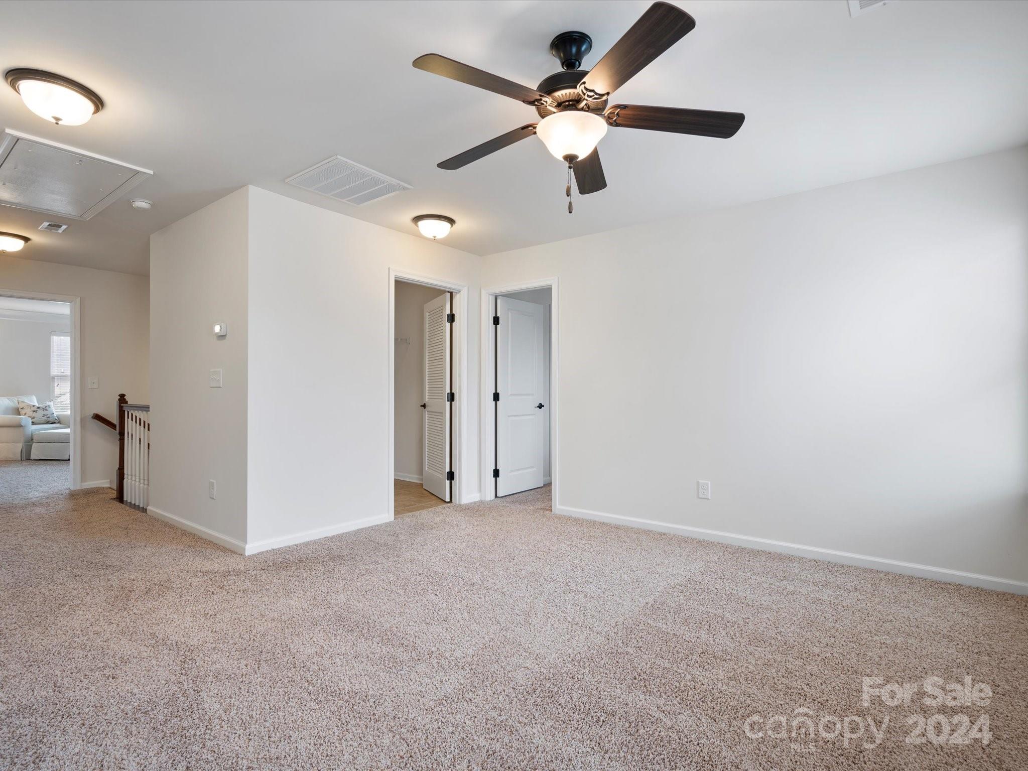 1617 Ridgehaven Road Waxhaw, NC 28173 - Photo 37 of 47 a view of an empty room and a ceiling fan