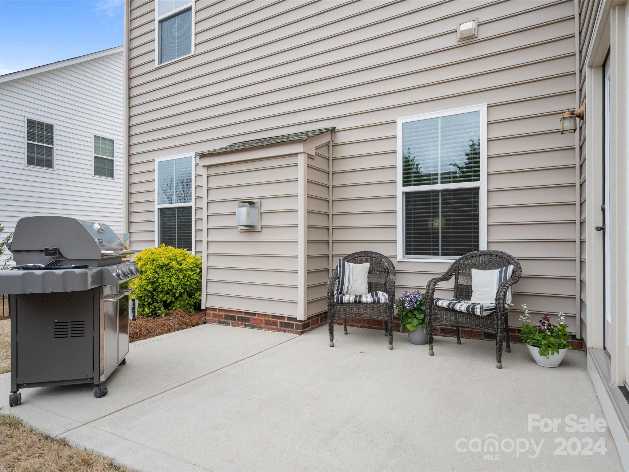 1617 Ridgehaven Road Waxhaw, NC 28173 - Photo 40 of 47 a view of a house with patio and a yard