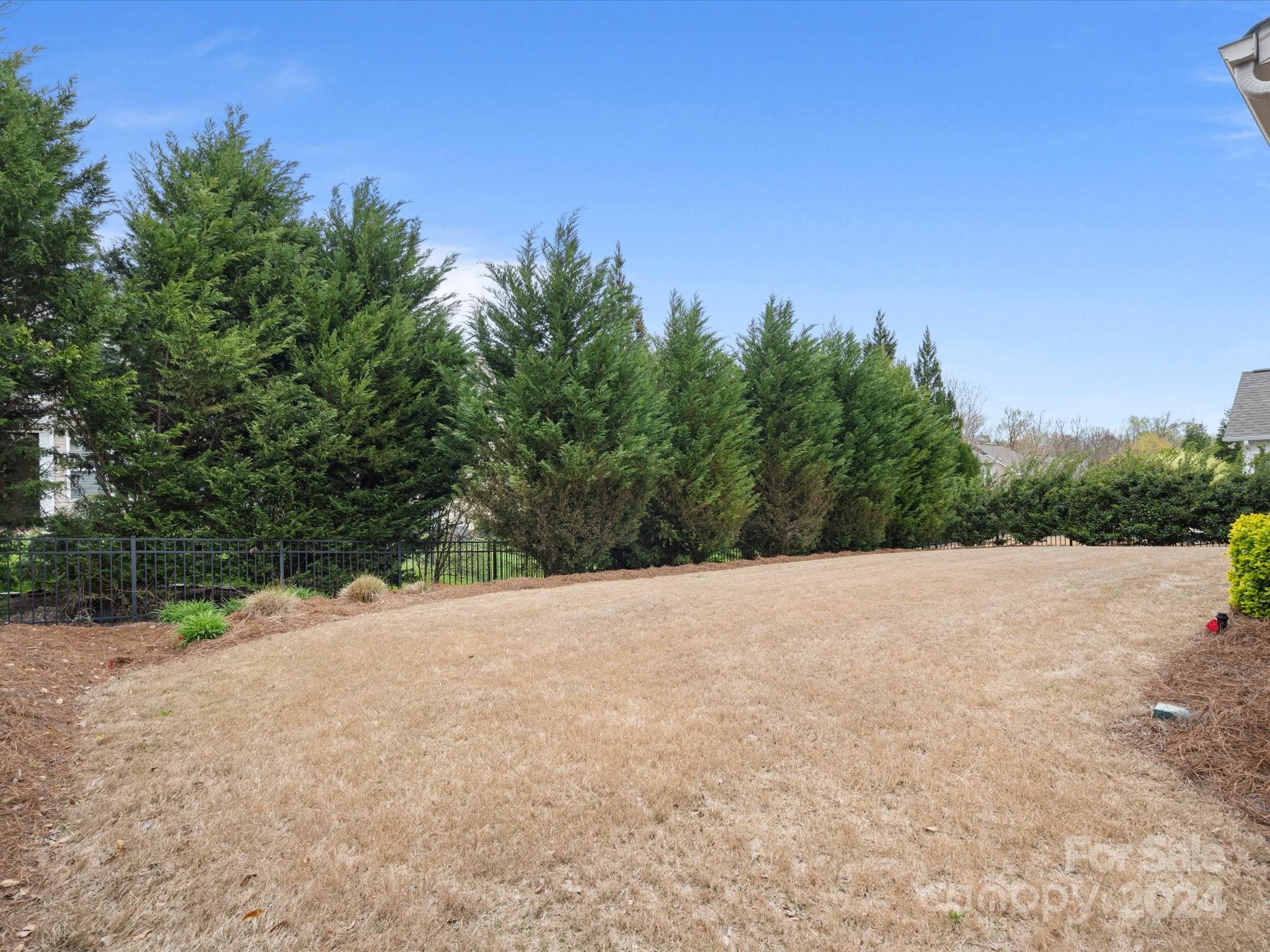 1617 Ridgehaven Road Waxhaw, NC 28173 - Photo 45 of 47 a wooden bench with trees in the background