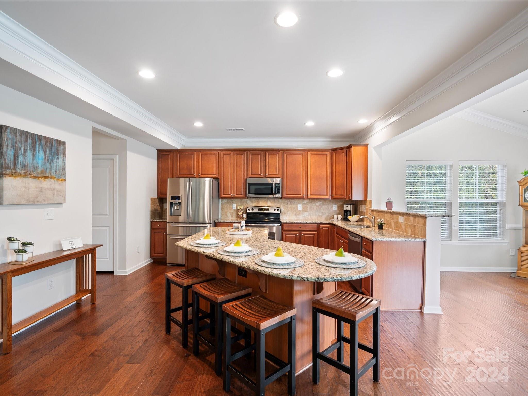 1617 Ridgehaven Road Waxhaw, NC 28173 - Photo 9 of 47 a kitchen with a table and chairs in it