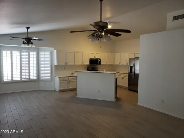 a kitchen with stainless steel appliances a stove a refrigerator and a sink