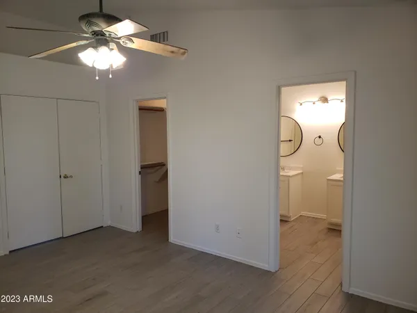 a view of a bathroom with a sink and a mirror