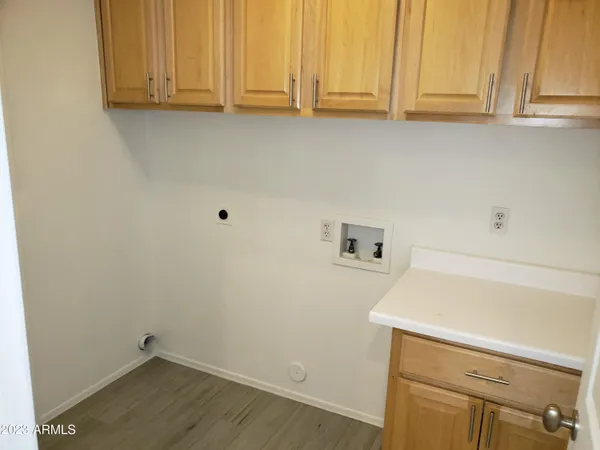 a view of cabinets and wooden floor
