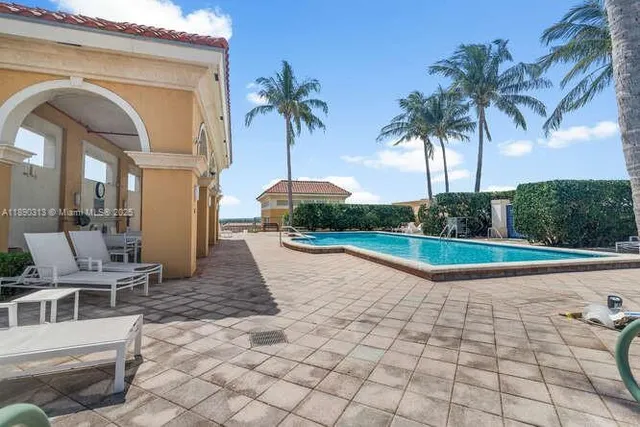 a view of multiple houses with a yard