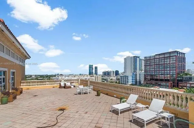 a view of roof deck with patio